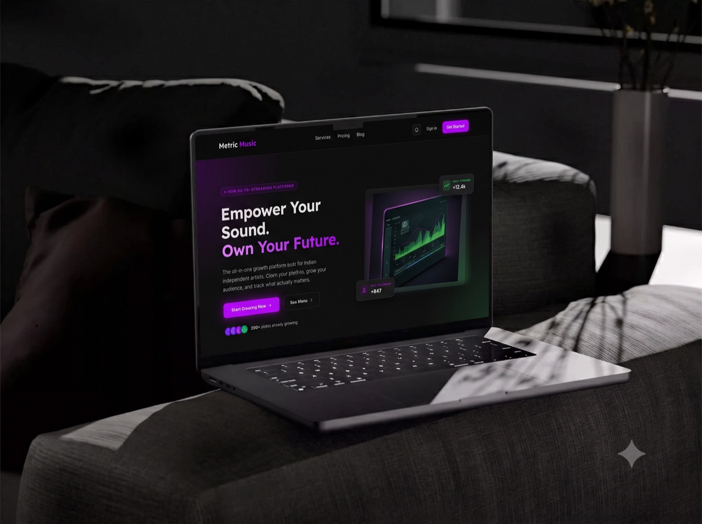 Metric Music landing page on a laptop